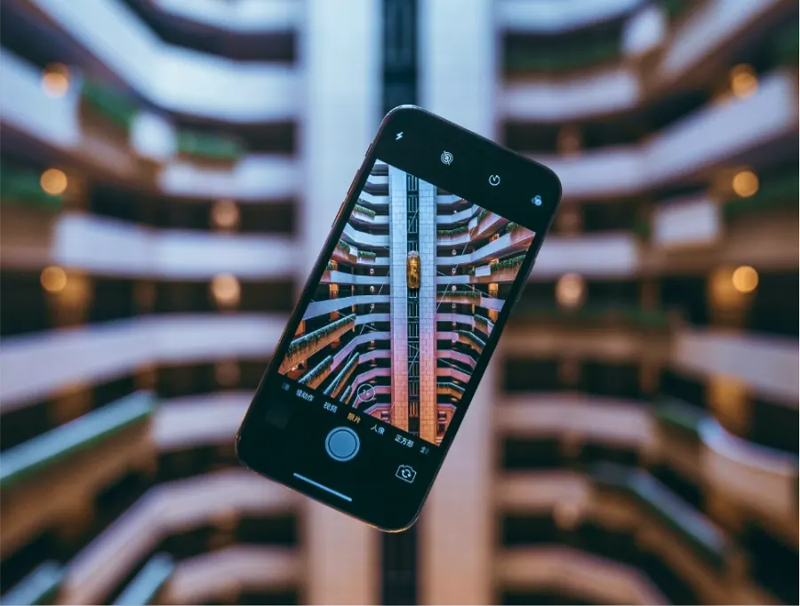 Smartphone inspecting a high-rise atrium
